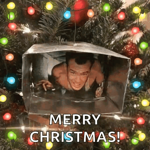 A Picture Of A Man In A Box With The Words Merry Christmas GIF