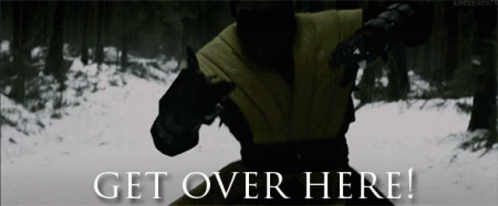 A Picture Of A Man In A Forest With The Words Get Over Here GIF