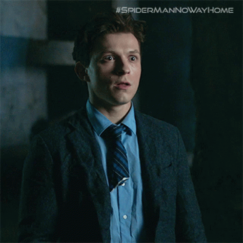 A Picture Of A Man In A Suit And Tie With The Caption " The Multiverse Is Real " GIF
