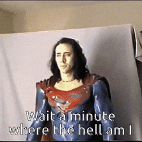 A Picture Of A Man In A Superman Costume With The Words Wait A Minute Where The Hell Am I GIF