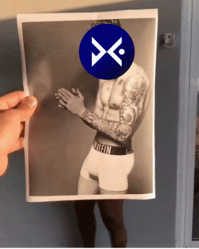 A Picture Of A Man In Calvin Klein Underwear Is Being Held Up By Someone GIF