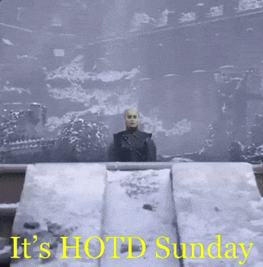 A Picture Of A Man In The Snow With The Words " It 'S Hot Sunday " GIF