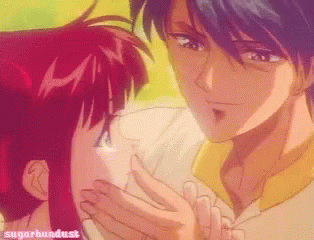 A Picture Of A Man Kissing A Girl With Sugarbundust Written On The Bottom Right GIF