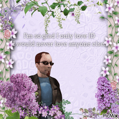A Picture Of A Man Surrounded By Purple Flowers With The Words I 'M So Glad I Only Love GIF