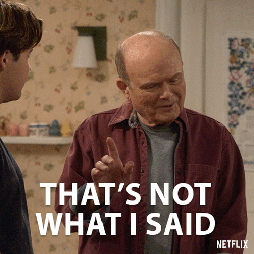 A Picture Of A Man Talking To Another Man With The Caption That 'S Not What I Said GIF