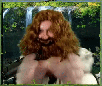 A Picture Of A Man With A Beard And Long Hair In Front Of A Waterfall GIF