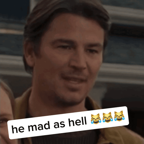 A Picture Of A Man With A Caption That Reads He Mad As Hell GIF