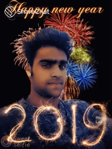 A Picture Of A Man With Fireworks In The Background And The Year 2019 GIF