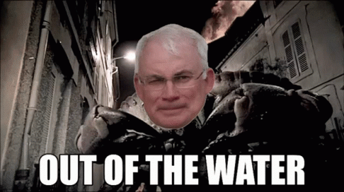 A Picture Of A Man With Glasses And The Words Out Of The Water Below Him GIF