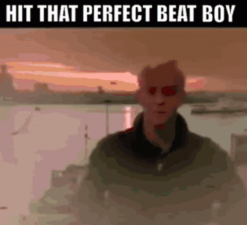 A Picture Of A Man With Red Eyes And The Words Hit That Perfect Beat Boy GIF