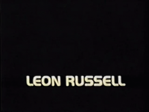 a picture of a man with the name leon russell on the bottom