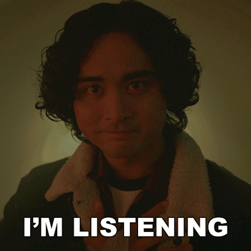 A Picture Of A Man With The Words " I 'M Listening " Behind Him GIF