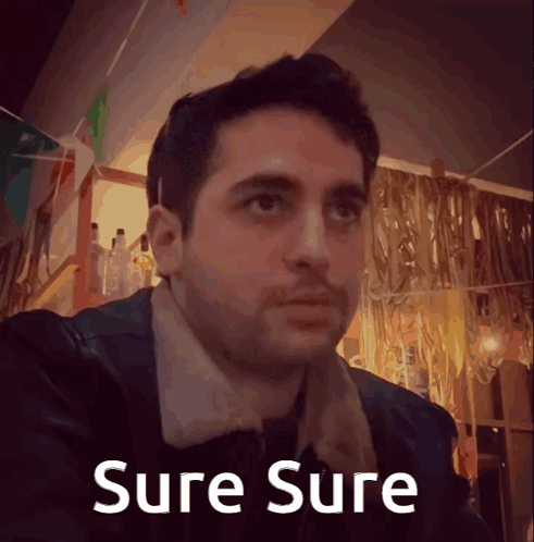 A Picture Of A Man With The Words Sure Sure Written Below Him GIF