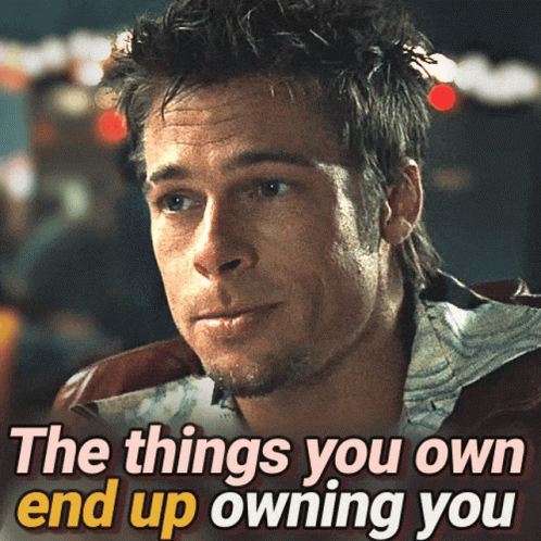A Picture Of A Man With The Words " The Things You Own End Up Owning You " Below Him GIF