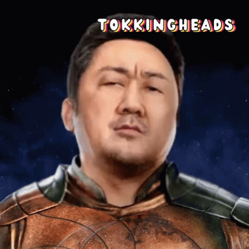 A Picture Of A Man With The Words Tokingheads Written Above Him GIF