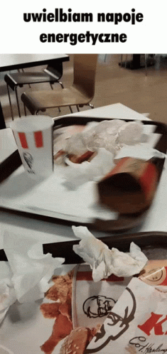A Picture Of A Messy Kfc Tray With A Cup On Top Of It GIF