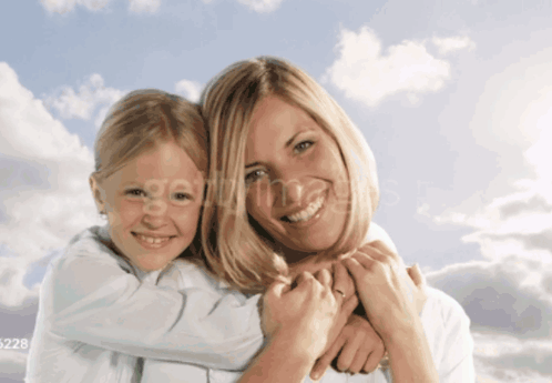 A Picture Of A Mother And Daughter With The Number 528 On The Bottom Left GIF