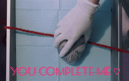 A Picture Of A Person Holding A Heart And The Words You Complete Me GIF