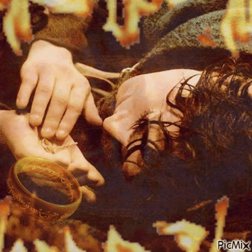 A Picture Of A Person Laying Down With A Ring On Their Hand With Picmix Written On The Bottom GIF