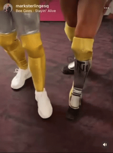 A Picture Of A Person 'S Legs With The Words Bee Gees Stayin ' Alive At The Bottom GIF