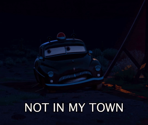 A Picture Of A Police Car With The Words " Not In My Town " Below It GIF