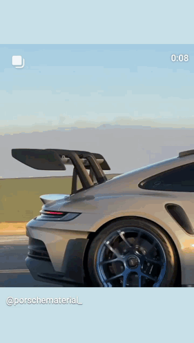 A Picture Of A Porsche Car With A Spoiler On It GIF