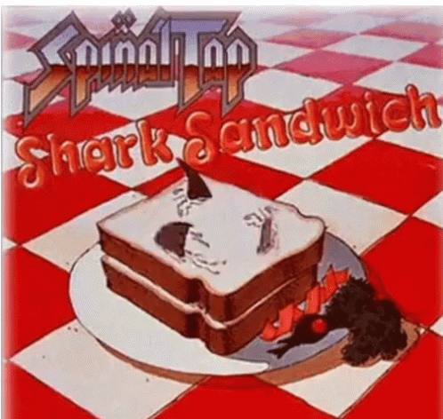 A Picture Of A Shark Sandwich On A Plate GIF