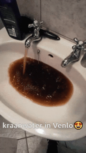 A Picture Of A Sink With Kraanwater In Venlo Written Below It GIF