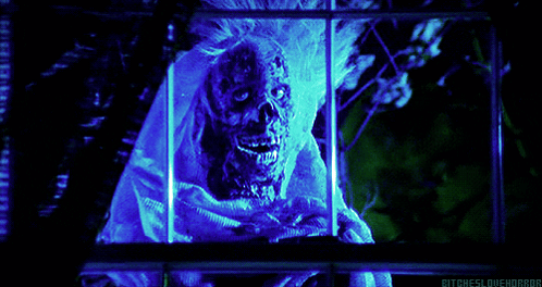 A Picture Of A Skeleton With A Blue Light Behind It That Says Bitcheslovehorror GIF