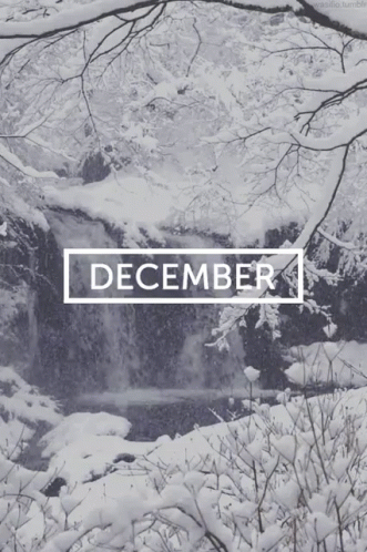 A Picture Of A Snowy Waterfall With The Month Of December GIF