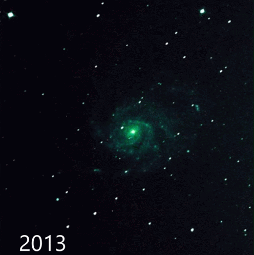 A Picture Of A Spiral Galaxy With The Year 2015 At The Bottom GIF