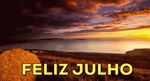 a picture of a sunset over the ocean with the words feliz julho