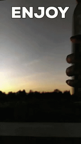 A Picture Of A Sunset With The Words Enjoy Written On It GIF