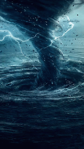 A Picture Of A Tornado In The Middle Of The Ocean With A Lightning Strike GIF