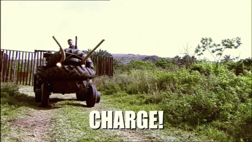 A Picture Of A Tractor With The Word Charge Written On It GIF
