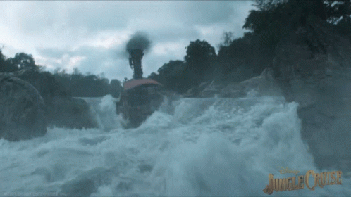 A Picture Of A Waterfall With The Words Jungle Cruise On The Bottom GIF