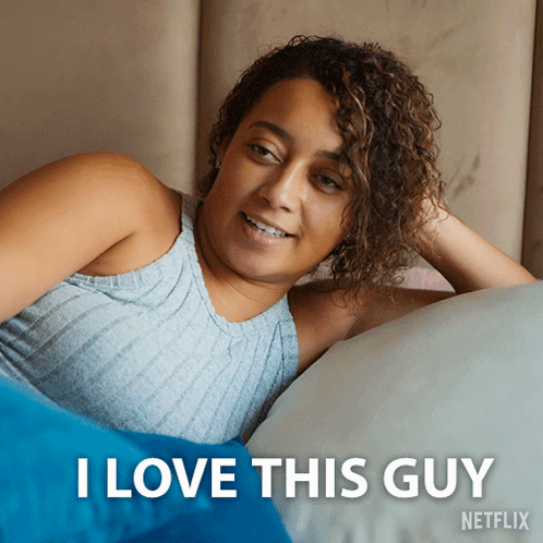 A Picture Of A Woman Laying On A Bed With The Caption I Love This Guy Netflix GIF