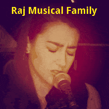 A Picture Of A Woman Singing Into A Microphone With The Words Raj Musical Family So Beautiful Below Her GIF