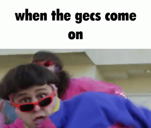 A Picture Of A Woman Wearing Sunglasses With The Words When The Gecs Come On GIF