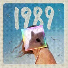 A Picture Of A Woman With A Cat In Front Of Her Face And The Year 1989 GIF