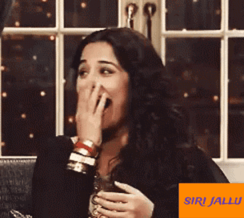 A Picture Of A Woman With An Orange Sticker That Says Siri Jalu On It GIF