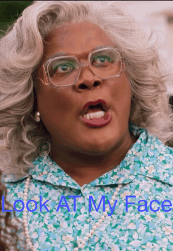 A Picture Of A Woman With Glasses And The Words Look At My Face Above Her GIF