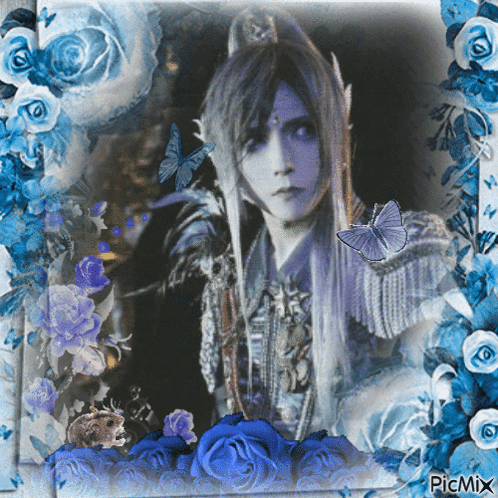 Woman Surrounded By Blue Roses And Butterflies GIF