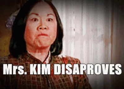 A Picture Of A Woman With The Words Mrs. Kim Disaproves Above Her GIF