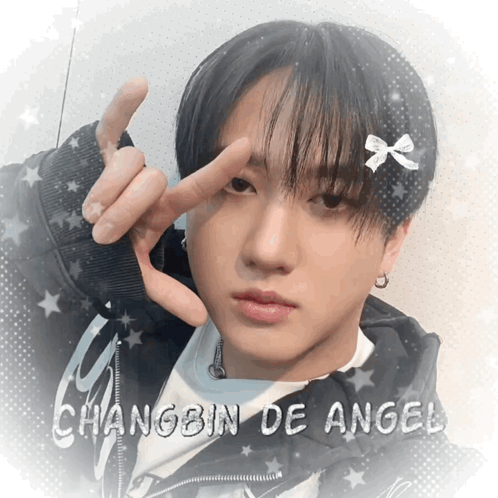 A Picture Of A Young Man With The Name Changbin De Angel On The Bottom GIF