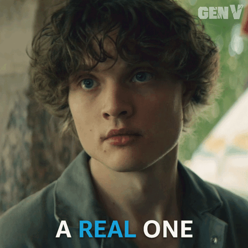 A Picture Of A Young Man With The Words " A Real One " Below Him GIF