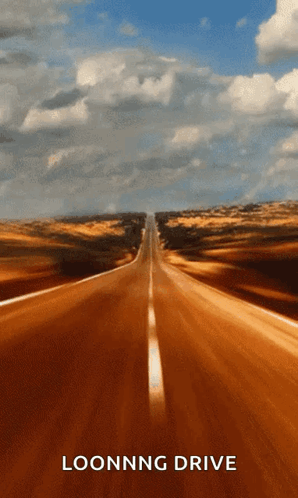 A Picture Of An Empty Road With The Words Loonng Drive On It GIF
