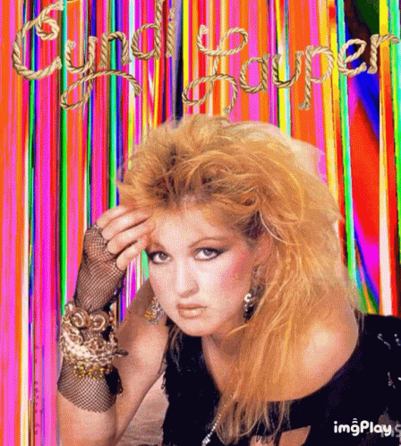 a picture of cyndi lauper with a rainbow background