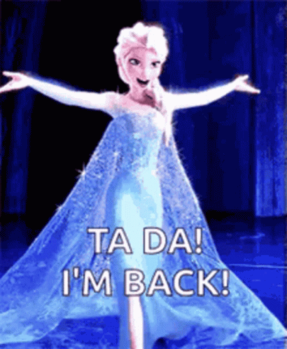 A Picture Of Elsa From Frozen With Her Arms Outstretched And The Words `` Ta Da ! I 'M Back '' . GIF