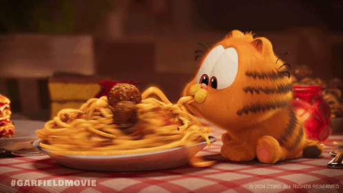 A Picture Of Garfield Eating Spaghetti And Meatballs From A Plate GIF